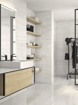 bathroom walls and floors with a 24x48 tile in of site color and subtle linear veins in warm tone, mimicking Bianco Dolomiti
