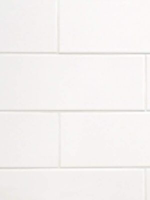 Large subway tile in white color for backsplash and bathroom walls to reduce the grout and bring in a cleaner look