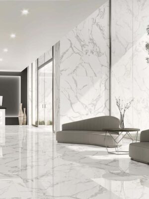 a lobby with bookmatching tile in white color