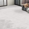 a patio with a light color with 48x48 concrete look tile in light earth tones