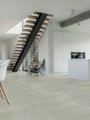 picture showing an open kitchen concept with very light wood look tile