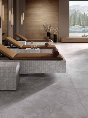 large porcelain tile that look like silver travertine in a modern living room floor