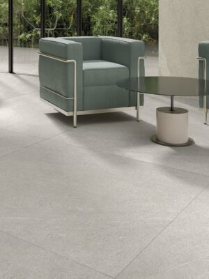 living room picture with a withe color porcelain tile that looks limestone. Subtle style but not industrial