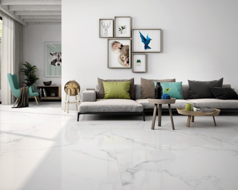 a livingroom with big tile white tiles and modern furniture in coastal colors