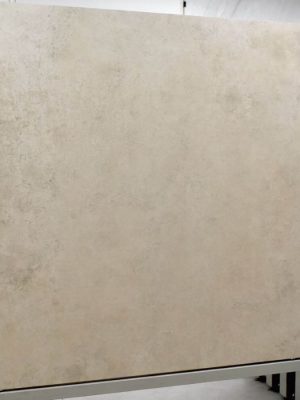 48x48 light ivory color concrete look tile in a showroom display