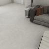 a living room with light gray color concrete look tile