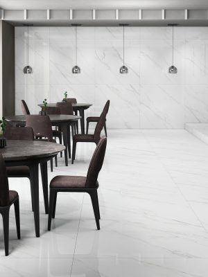 A living room with 48x48 floor tiles in whit color and subtle gray veining